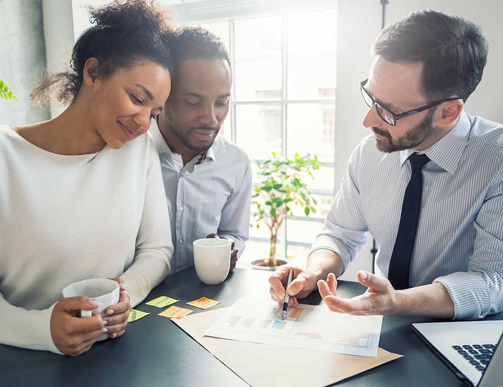 Couple reviewing options with banker