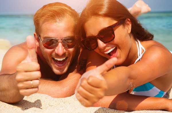 Couple laying out on beach